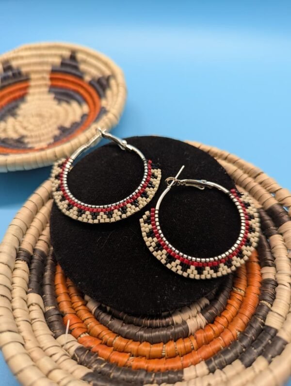 A Pair Of Hand-Beaded Mesa Steps Hoop Earrings, Showing The Clean Lines Of The Brick Stitch And The Color-Blocking Of The Cream, Black, And Red Beads On The Stainless Steel Hoops.