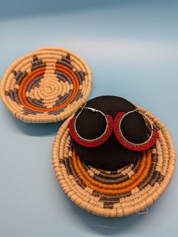 Adakair'S Ristra Red Brick Stitch Hoop Earrings Displayed On A Black Stand. The Beads Show A Fiery Gradient From Bright Crimson To Deep Red, Mimicking A Sun-Dried Chile Ristra.