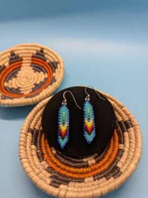 Soulful Blue Canyon Hand-beaded feather earrings in Blue Canyon with sterling silver hooks, deep cobalt and aqua gradient with yellow and red chevrons
