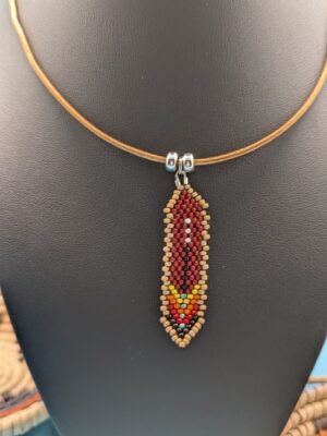 Sandstone Ember Hand beaded feather necklace, close up image Sandstone Ember, red and gold tones with tan edge beads, sterling silver accents on premium leather by Adakair.
