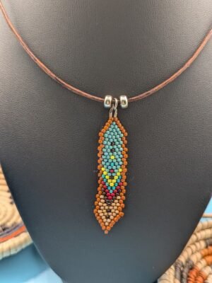 Hand beaded feather necklace, Sage and Clay, muted turquoise and earth tones with tan edging, sterling silver accents on leather.