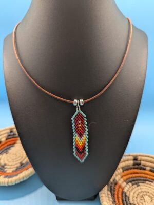 Nightfire , Hand beaded feather necklace, Nightfire, black and red with yellow highlight and turquoise edge, sterling silver accents on leather.